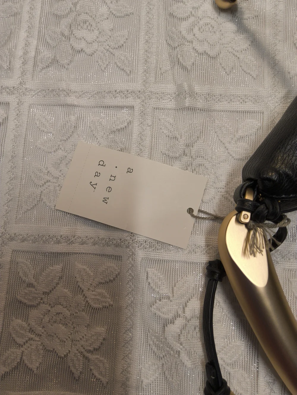 A New Day Crescent Handle Bag in Black with Gold Accent